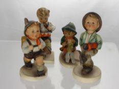 Four Miscellaneous Hummel Figures, including Young Boy and Bird 63, Boy with Umbrella 109/0, Boy