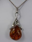 A Lady's Amber and Silver Pendant, in the form of a pear, approx 18 gms together with an enamel