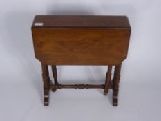 An Antique Mahogany Sutherland Drop Leaf Table on turned legs, approx 55 x 48 x 55 cms.