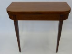 A Regency Mahogany Inlaid Card Table, on tapered legs.