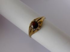 A Gentleman's 9 ct Gold and Garnet Ring, size Z plus, together with a 9 ct gold, blue topaz and