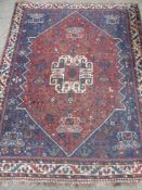 A Vintage Middle Eastern Woollen Rug, of floral design with floral border, approx 110 x 160 cms,