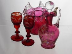 A Victorian Cranberry Glass Vase with a clear glass shaped rim, approx 10 cms high, a Cranberry