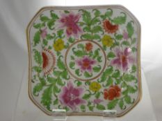 A Miscellaneous Collection of Three Antique Famille Rose Plates, two depicting flowers, the other