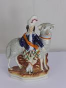 A Staffordshire Flat Back Figure of a Highland Lady with her sheep.