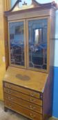 A Georgian Style Edwardian drop front secretaire book case, the book case having inlay to front with