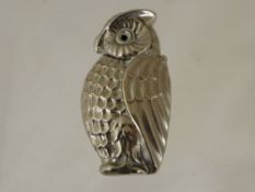 A White Metal Vesta in the form of an owl.