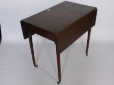 An Antique Mahogany Drop Leaf Pembroke Table, the table having one real and one dummy drawer, on
