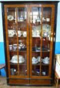 A Contemporary Art Deco Walnut and Ebonized Style Display Cabinet, with four internal shelves and