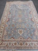 A Contemporary Middle Eastern Rug, blue grey ground with geometric design, approx 260 x 166 cms.