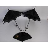 Two Victorian Ebonised Handle Parasols together with an embroidered and painted mourning fan.