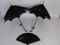 Two Victorian Ebonised Handle Parasols together with an embroidered and painted mourning fan.
