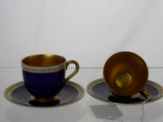 A Pair of Royal Worcester Factory Demi-Tas Cups and Saucers, in cobalt blue with white beaded