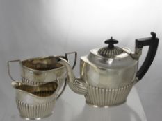 A Silver Tea Trio, comprising tea pot, milk jug and twin handled sugar bowl, Birmingham hallmark, mm