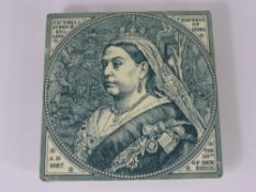 A Minton China Work Teapot Tile Stand, depicting Queen Victoria together with 1837 - 1887 Jubilee