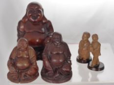 A Miscellaneous Collection of Chinese Carved Figures, including three Buddhas, two characters with