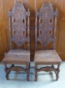 Two Circa 1900 Gothic Style Oak Carved Altar Chairs, the chairs having turned column back with