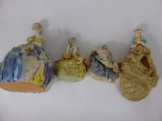 A Miscellaneous Collection of Antique Porcelain Figure Pin Cushions, the figures depicting 1920's