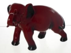 A Royal Worcester Flambe Porcelain  Figure in the form of an Elephant, approx 20 cms long x 7 cms
