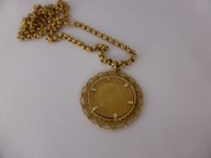 An Edward VII 1902 Full Sovereign, in 9 ct gold mount on 9 ct gold chain (9 ct approx 8 gms).