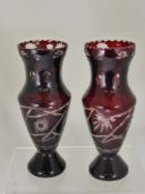 A Pair of Antique Cut Glass Cranberry Vases, approx 27 cms high.