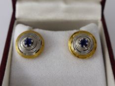 A Pair of Lady's 18 ct Yellow, White Gold and Sapphire Disc Coil Earrings, approx wt 4.5 gms.