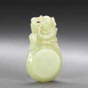 A Chinese Carved Jade Figure of a Boy,  the boy sitting on a drum carrying a branch over his