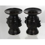 A Pair of Antique Japanese Bronzed Vases, the vases having ducks and fish to centre cartouche on