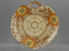 A Charlotte Rhead for Bursley-Ware Decorative Plate, with back stamp to base, the plate of