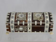 An Antique Oriental Schrimshaw Tortoiseshell Veneered Casket, the casket having floral and deity