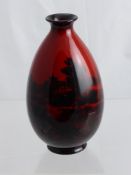 A Royal Doulton Flambe Ware ovoid vase, the vase no. 7777 signed to base, approx 16 cms.