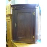 An Oak Corner Cabinet, approx 80 x 46 x 106 cms.