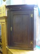 An Oak Corner Cabinet, approx 80 x 46 x 106 cms.