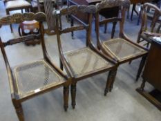 Six Regency Mahogany Dining Chairs, three chairs having carved backs with rattan seats, two chairs