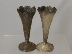 A Pair of Indian Silver Vases, of decorative form with embossed foliate design, stamped SM, approx