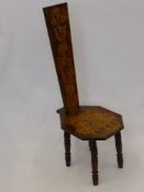 An Antique Oak Stick Back Chair, the chair having pen work design depicting flowers and fruit, on