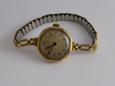 A 9 Ct Gold 375 Hallmark Lady's Vintage Rolex, having a silvered engine turned face, 15 rubies,