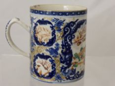 A 19th Century Blue and White Chinese Mug, with a cartouche depicting a domestic scene with