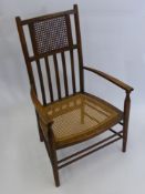 An Oak Rattan Seat Nursing Chair.