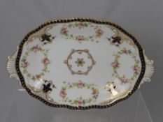 Four Antique Coalport Serving Dishes, two oval and two square, on cobalt ground with floral