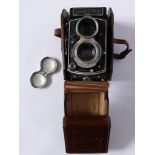 A Rolleicord Model V TLR Camera with original leather case and lens cap, serial no. 1557672 (1956)
