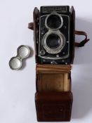 A Rolleicord Model V TLR Camera with original leather case and lens cap, serial no. 1557672 (1956)