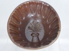 A Salt Glaze Pie Mould, the mould depicting a wheat sheaf. (1)