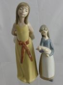 A Lladro Figure Depicting a Girl, no. 5006 together with another numbered 1011.