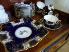 A Collection of Viennese Crockery, comprising two square dishes, twelve tea plates, six cups and six