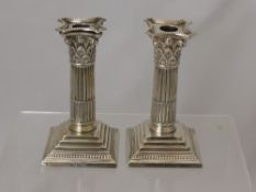 A Pair of Silver Weighted Candle Sticks, in the form of Corinthian columns, Sheffield hallmark,