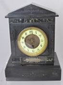 A Victorian Slate Mantle Clock, having marble inlay and silver engraved "Presented to Mr J Boughton,