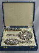 A Solid Silver Ladies Dressing Table Set, comprising hair brush, mirror and clothes brush in