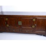 A Circa 1900 Chinese Fruit Wood Sideboard, the sideboard having cupboards to either side with