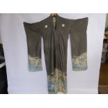 A Vintage Silk Japanese Kimono, the kimono depicting mountain scenes.